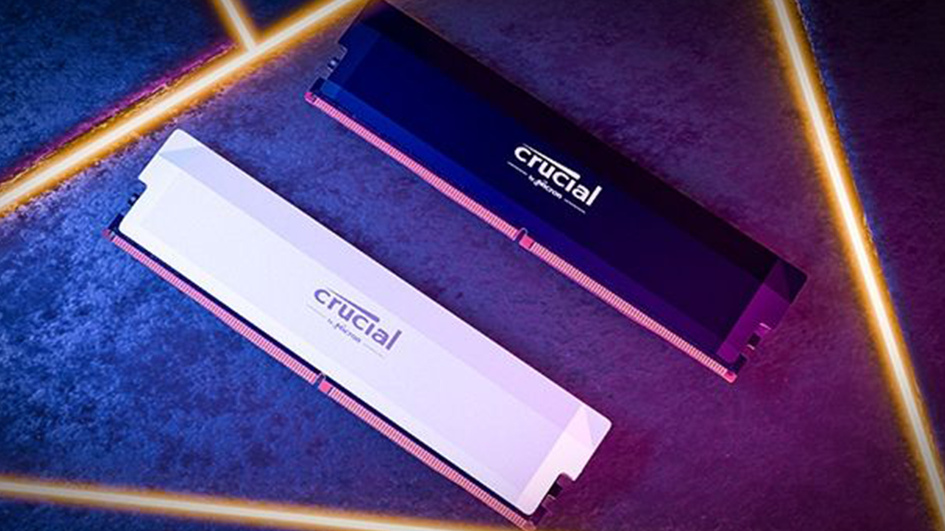 Two Crucial RGB RAM sticks on neon-lit surface