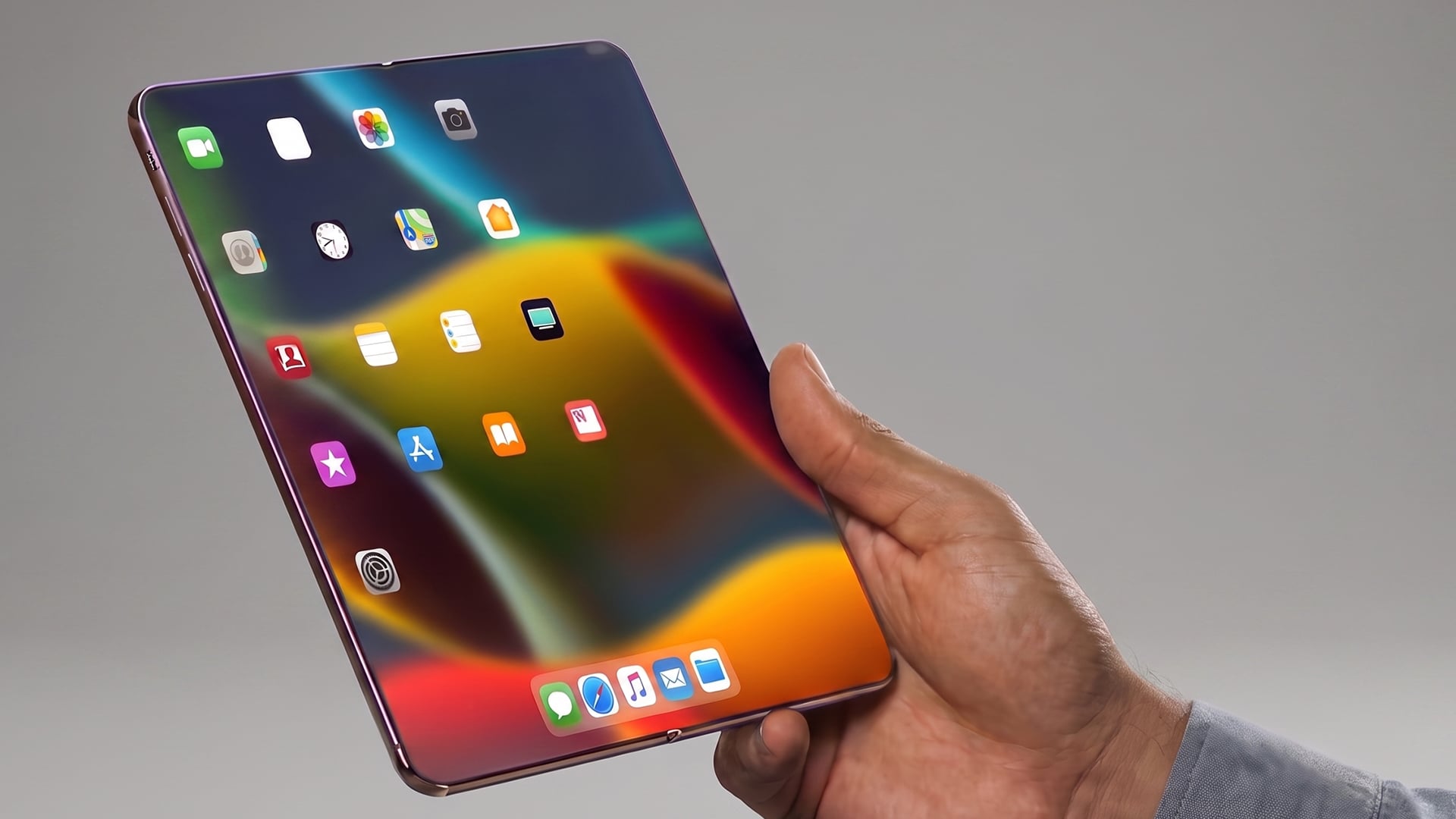 Person holding an unfolded Apple iPhone Fold with tablet screen.