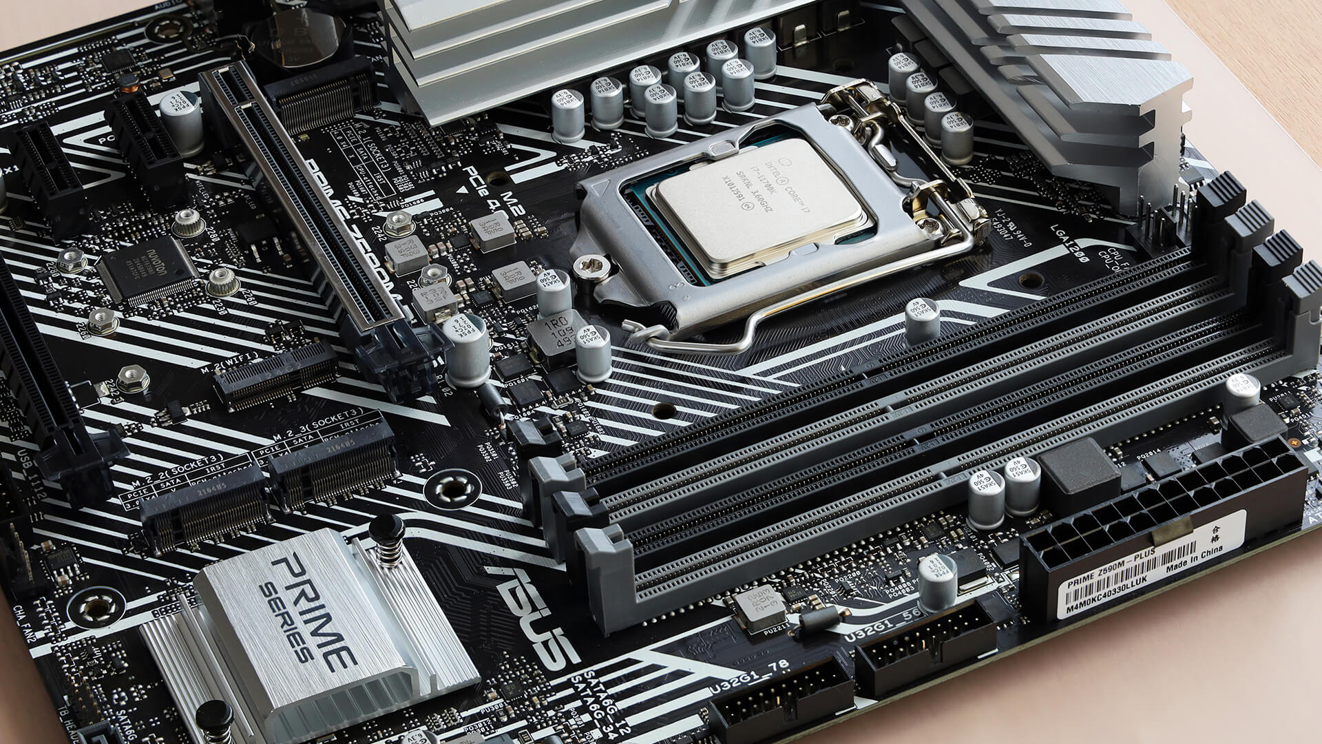 Detailed view of an ASUS Prime series motherboard with installed CPU and RAM slots.