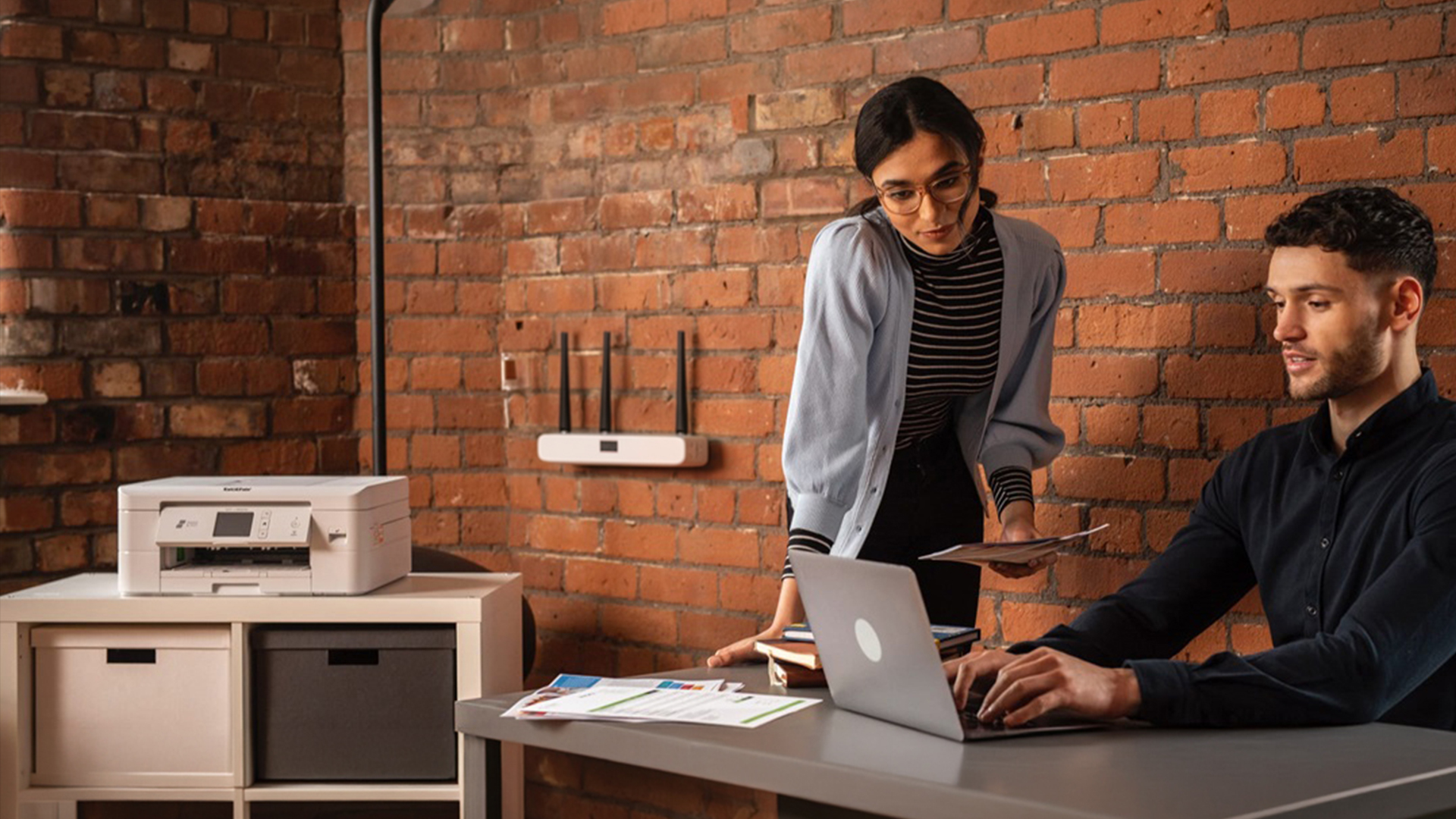 Colleagues printing wirelessly to a Brother printer.