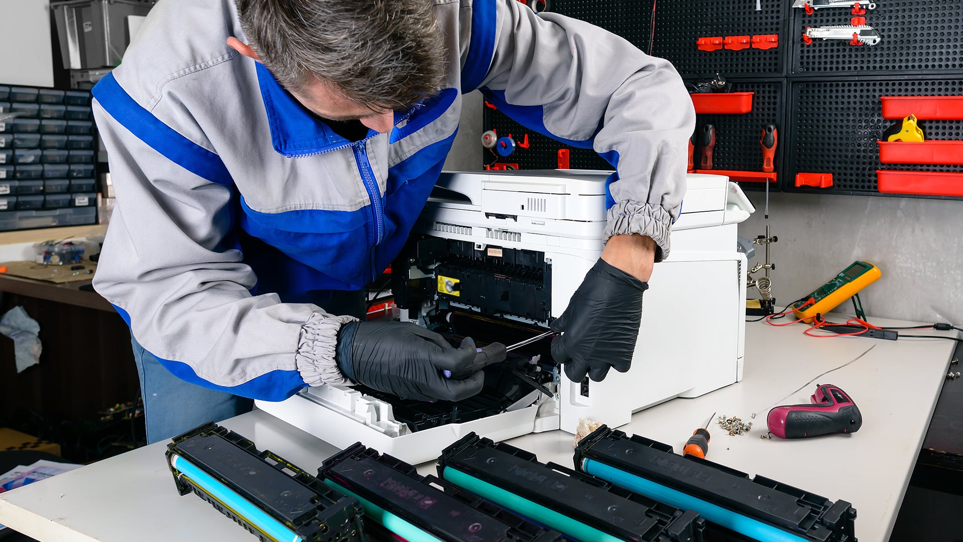Installing new ink cartridges into an inkjet printer.