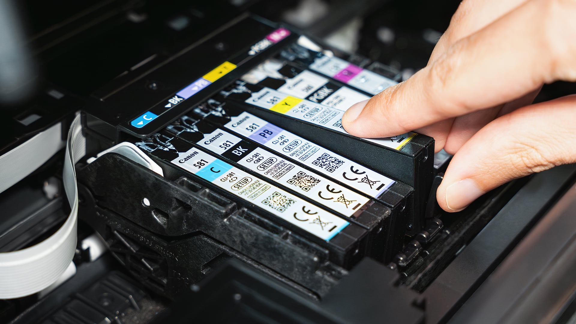 Installing Canon ink cartridges into the printer.