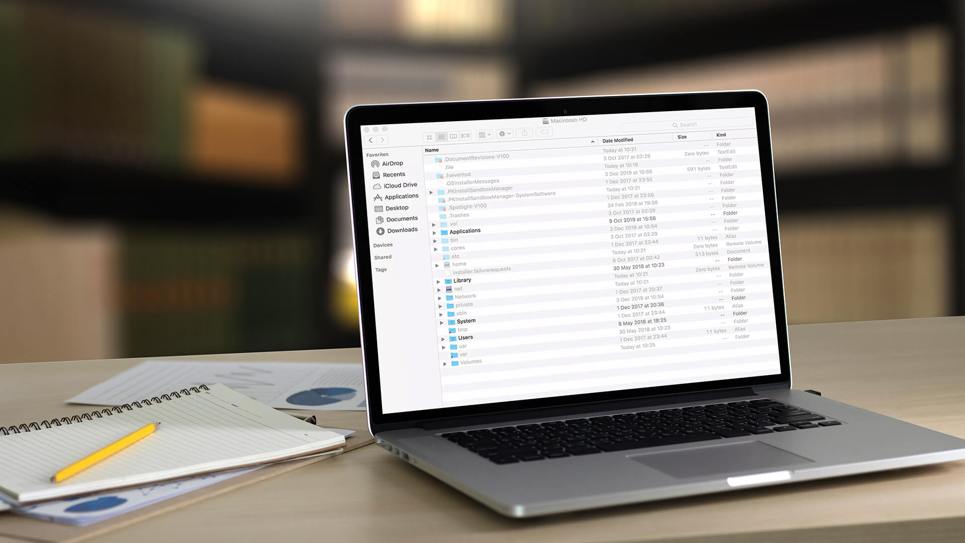 Laptop screen displaying a Finder window with visible hidden files.