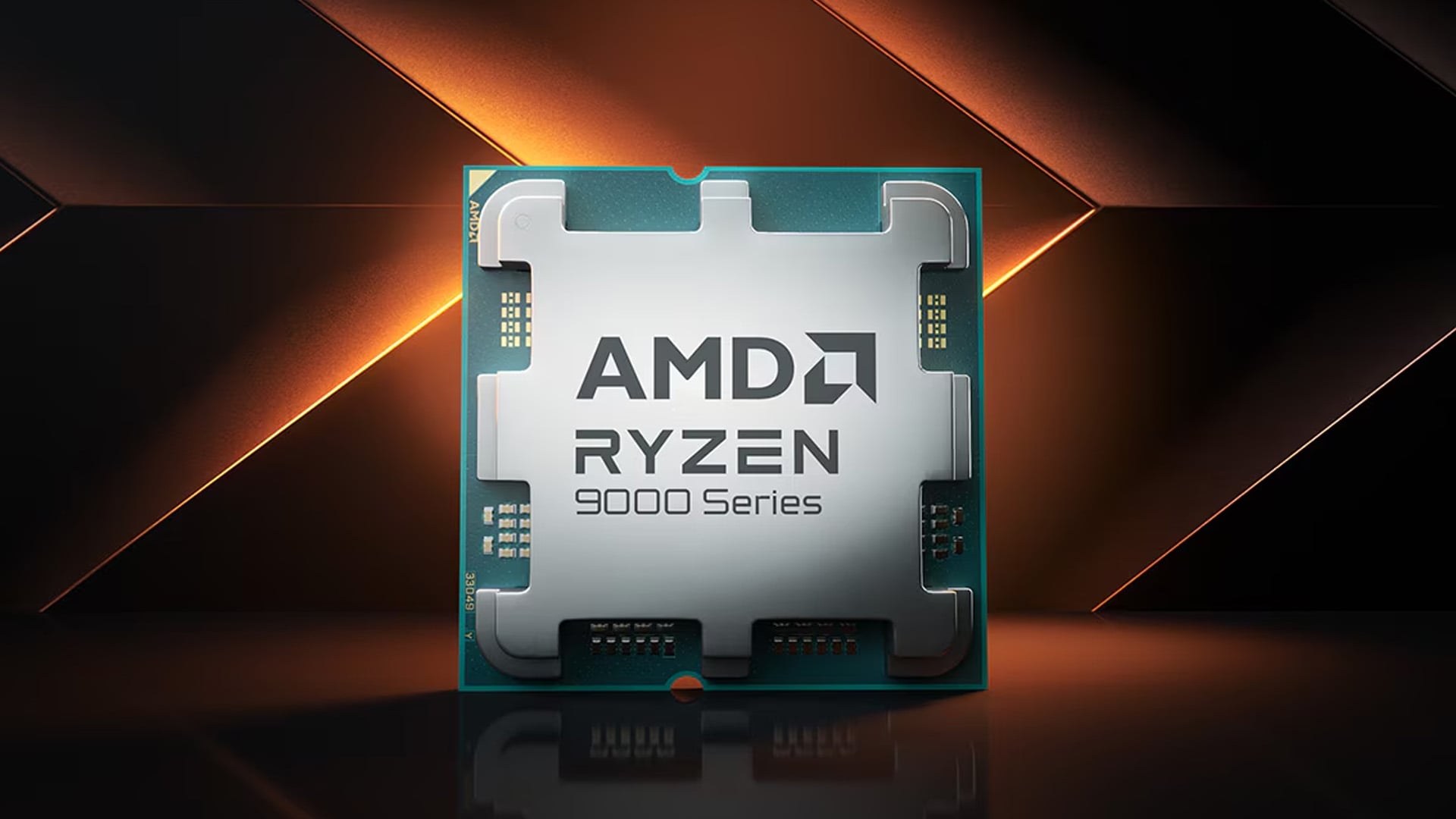 Close-up of an AMD Ryzen 9000 Series desktop processor with warm orange lighting.