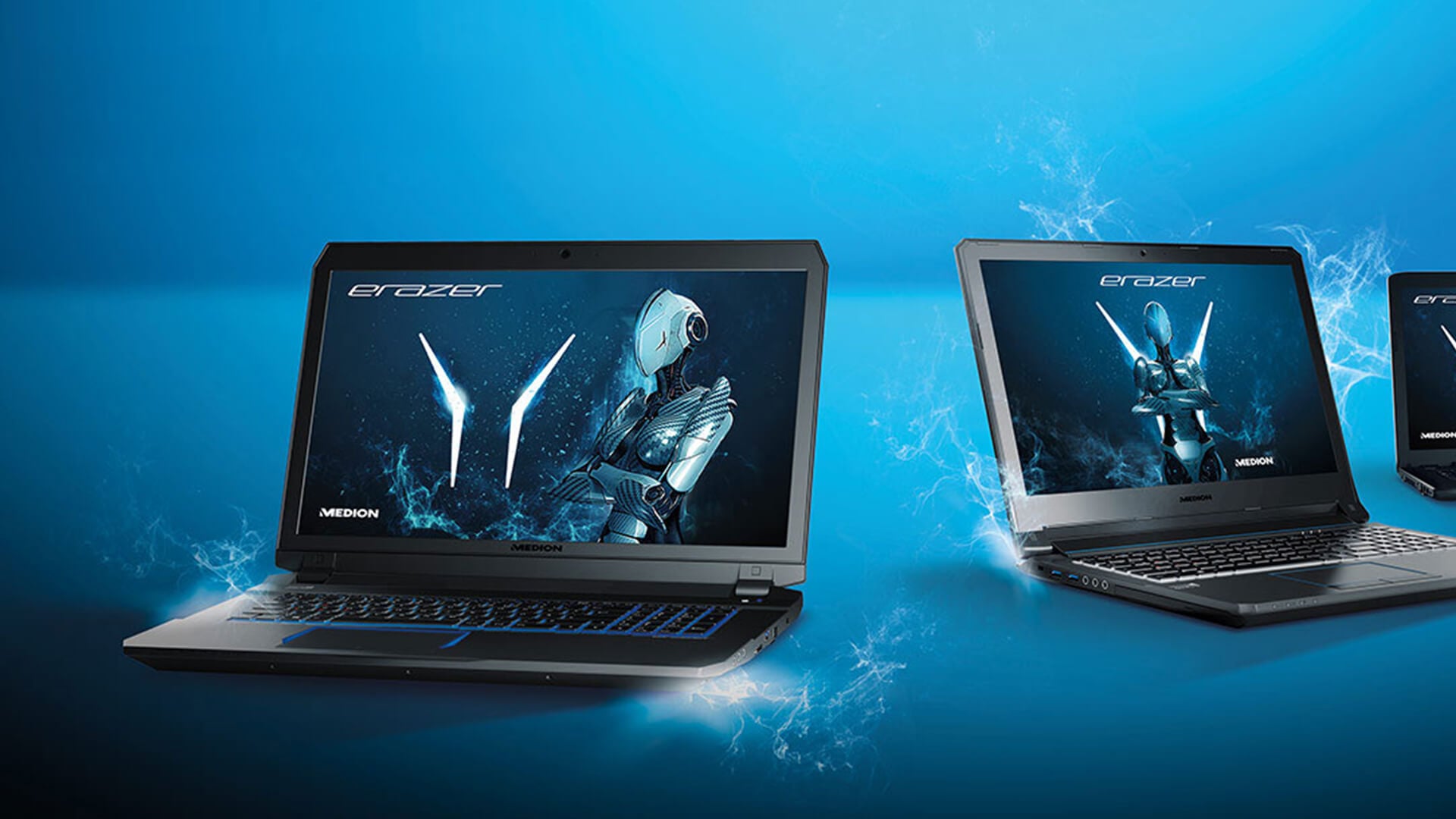 Multiple Medion ERAZER gaming laptops on a blue background.