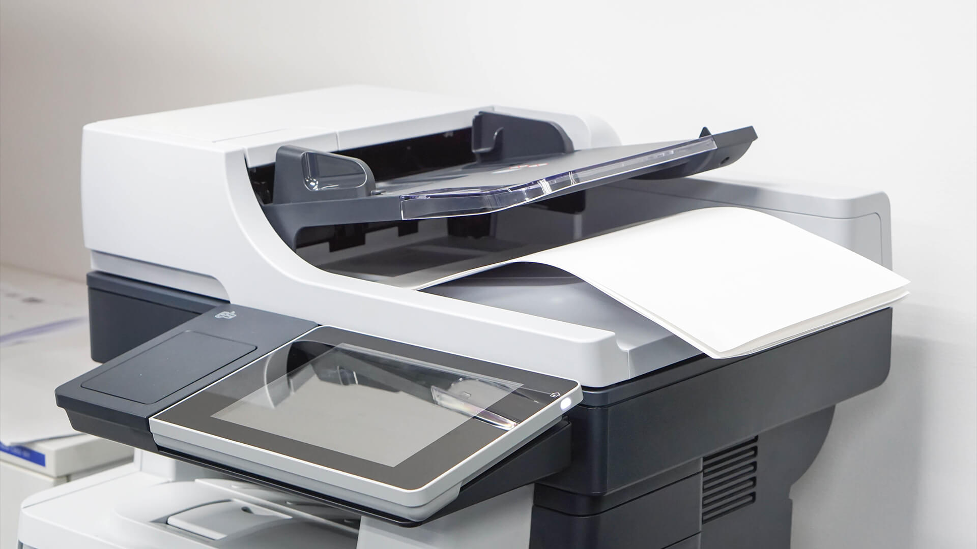Close-up of a multifunction office printer for duplex printing.