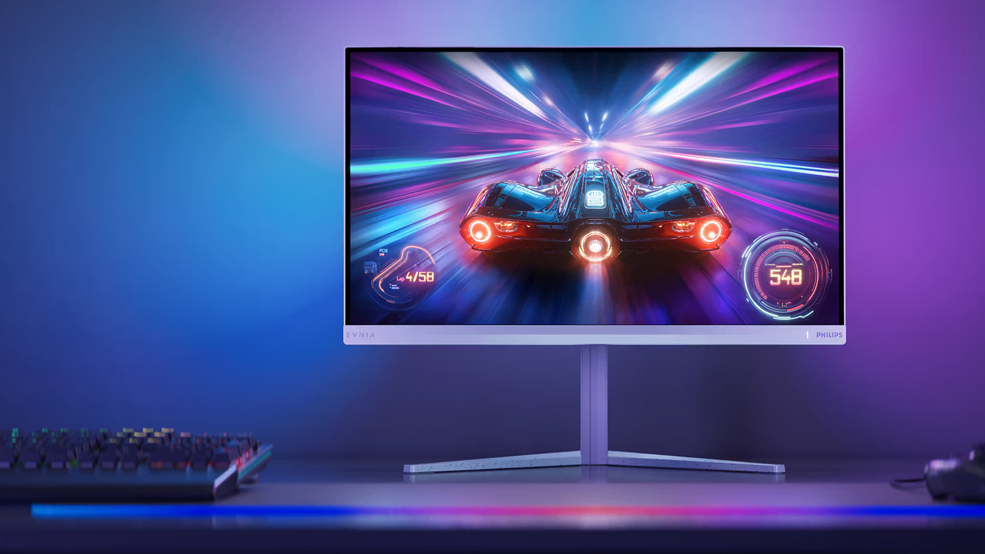 Philips monitor displaying a scenic wallpaper on a wooden desk.