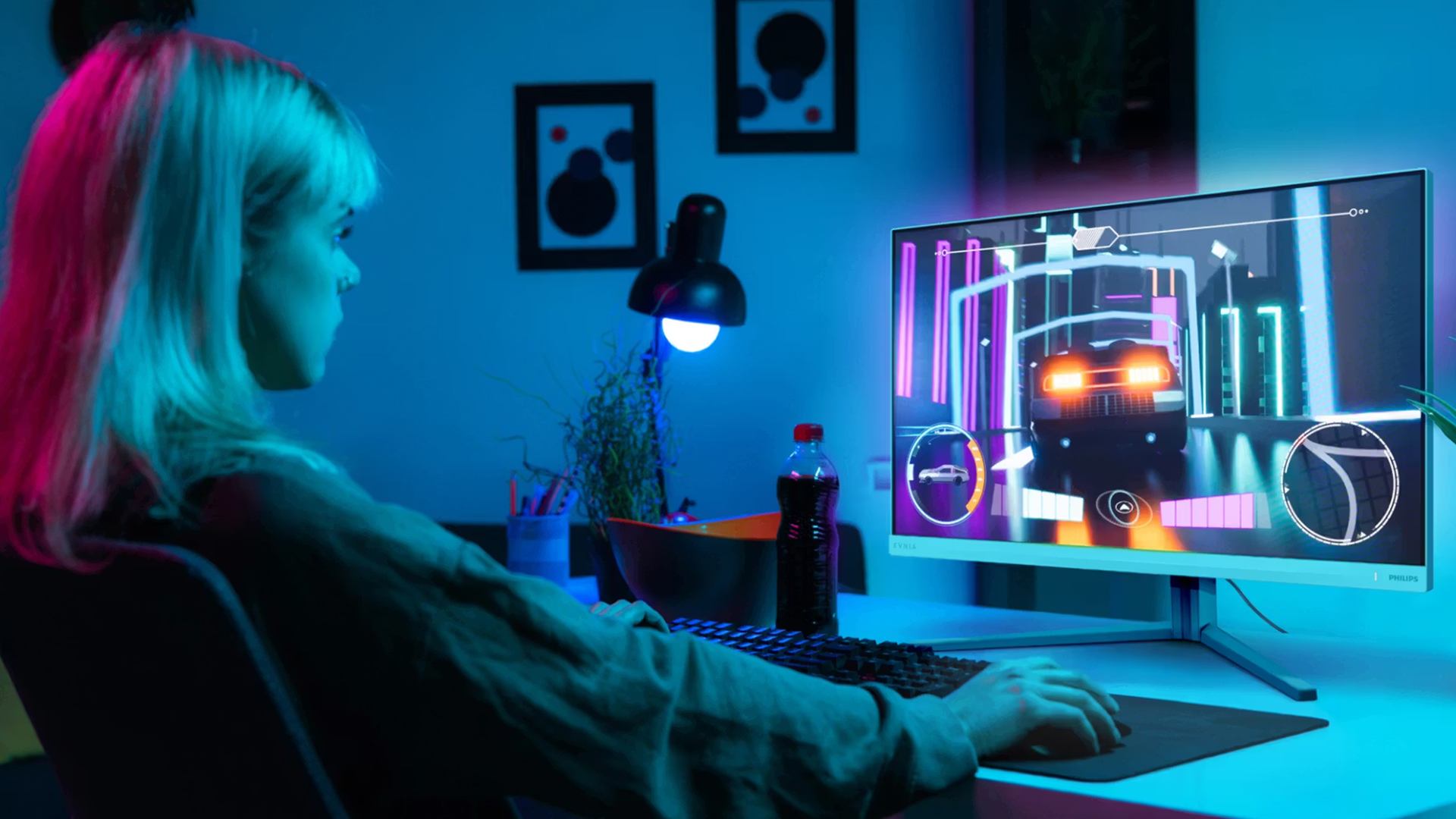 Philips Evnia gaming monitor with vibrant neon background lights.