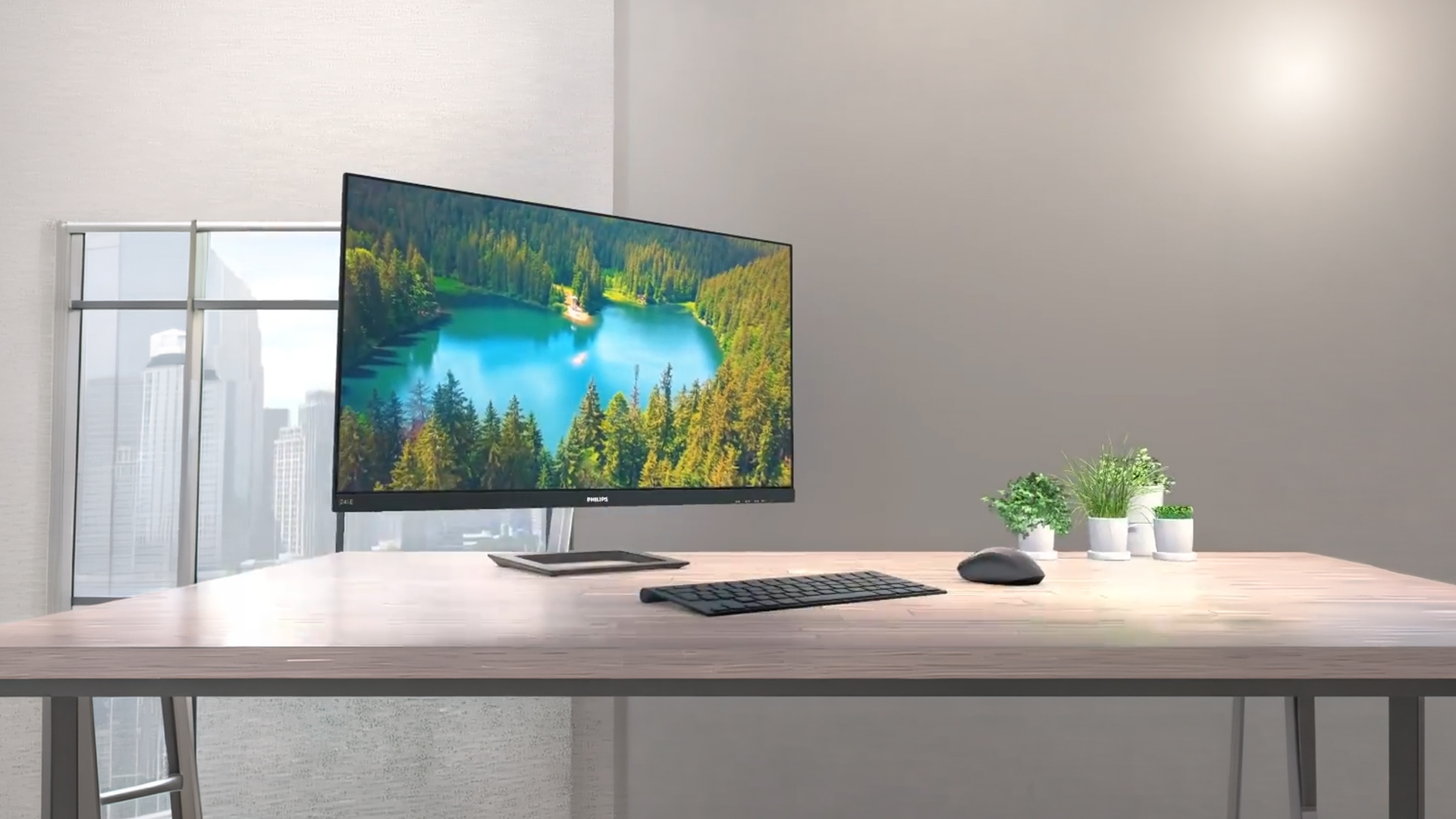Woman multitasking with open windows on a Philips monitor.
