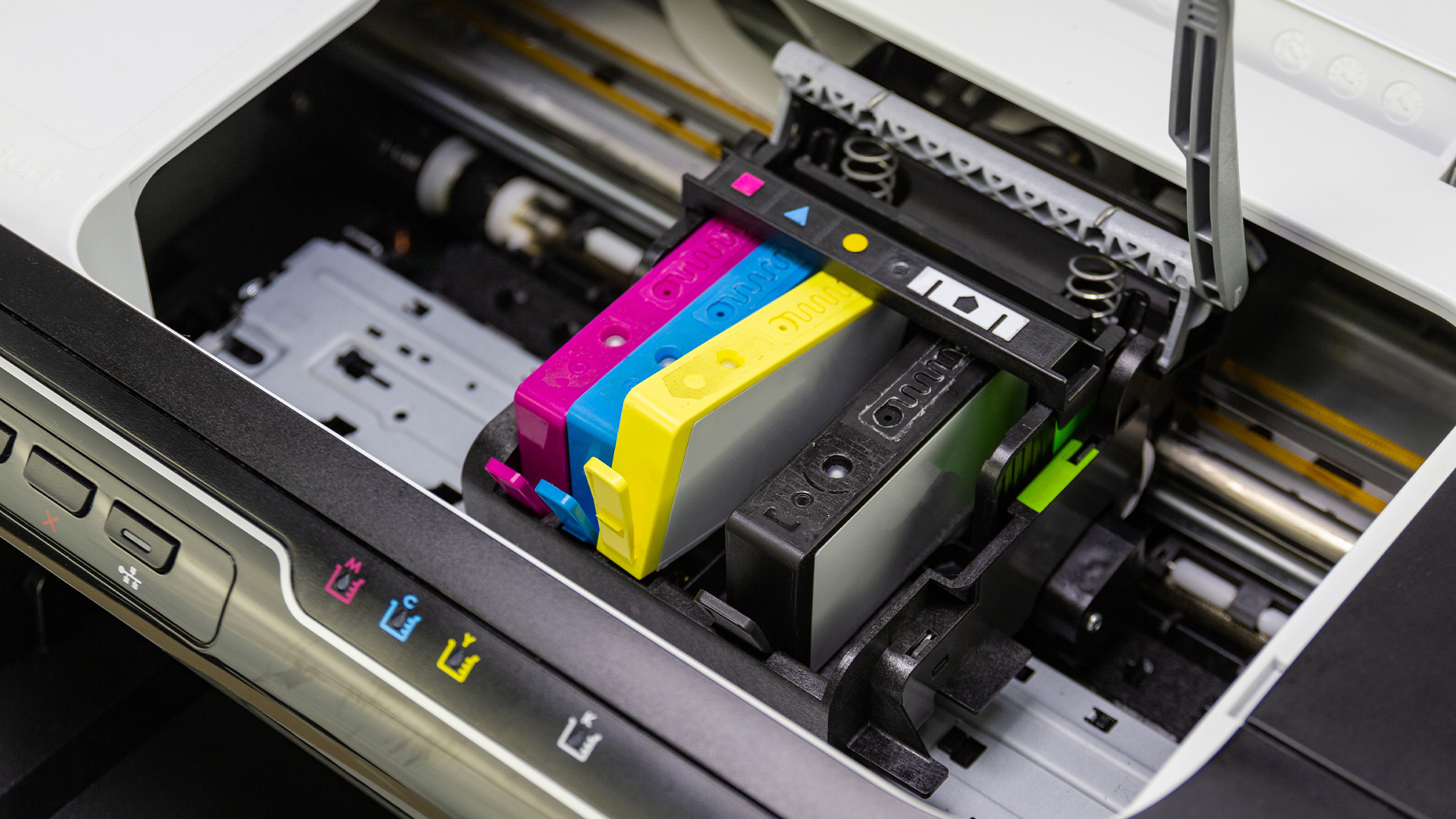 Technician repairing a professional office printer.