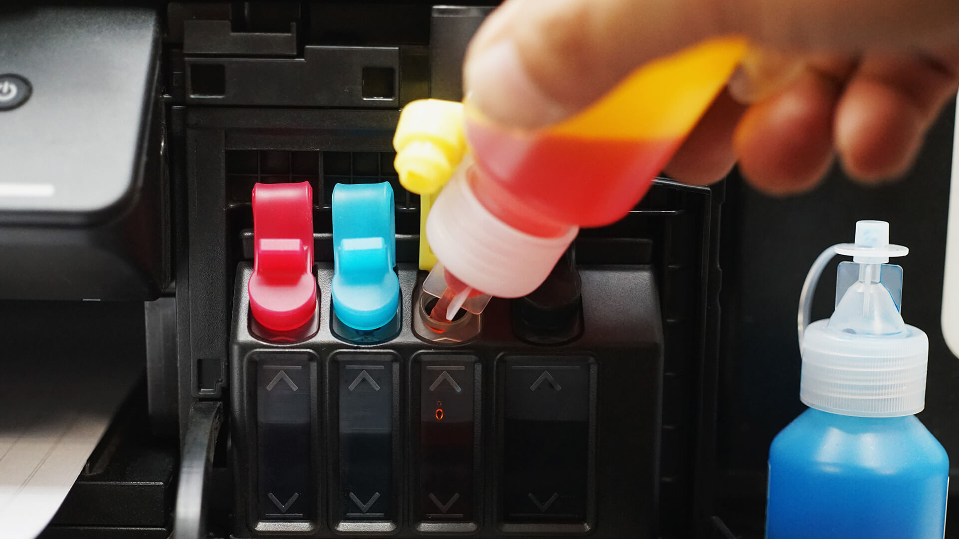 Color cartridges installed inside printer.