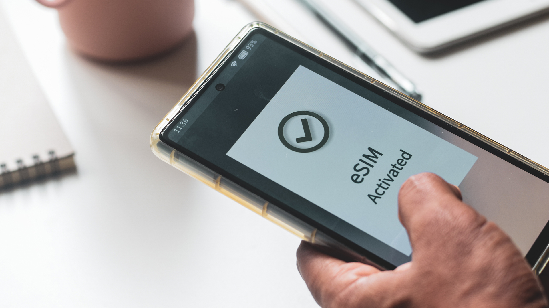 Smartphone screen showing eSIM successfully activated.