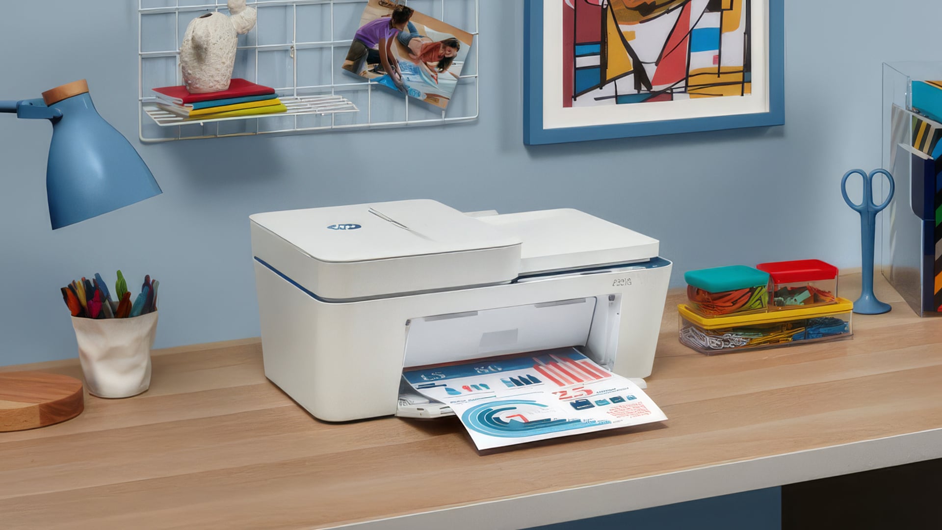 A white all-in-one printer printing a chart on a wooden desk.
