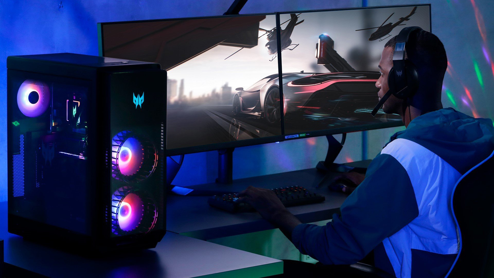 Gamer playing a racing game on a Windows dual-monitor PC.