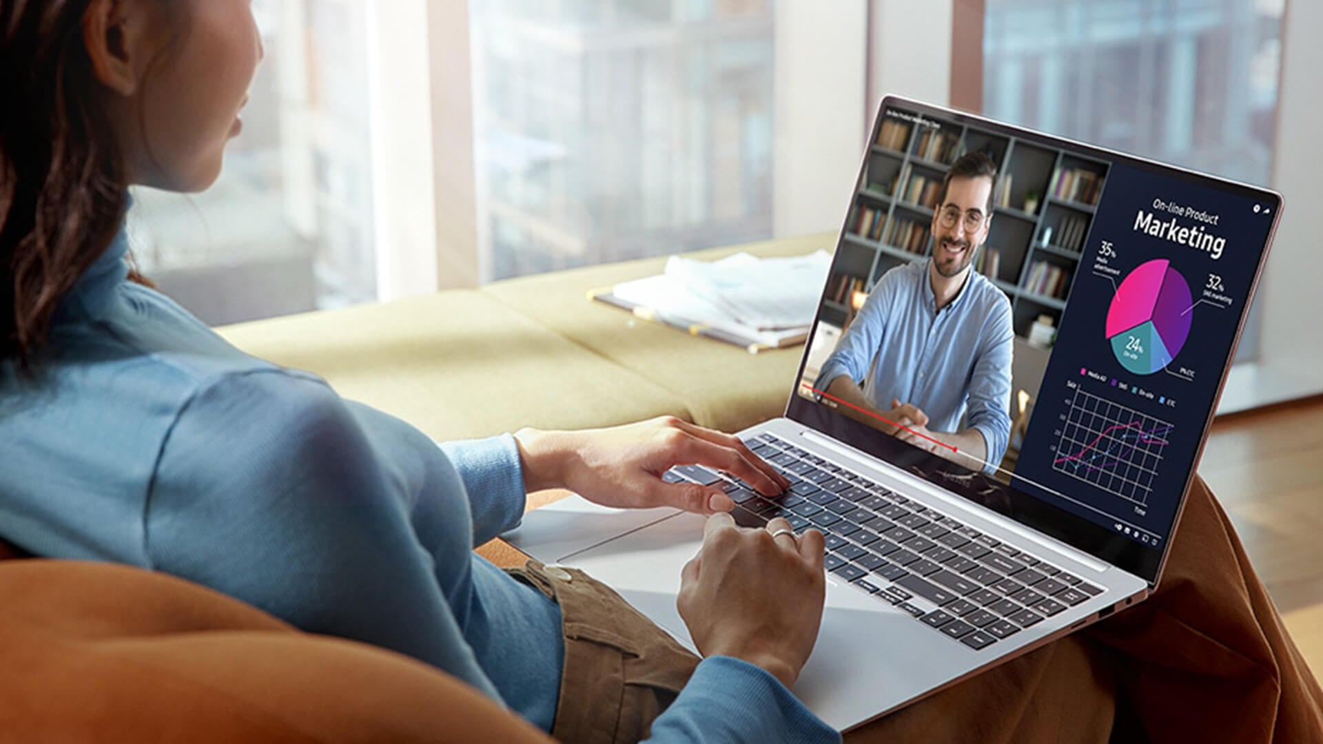 Woman participating in a video call on a Samsung Galaxy Book laptop.