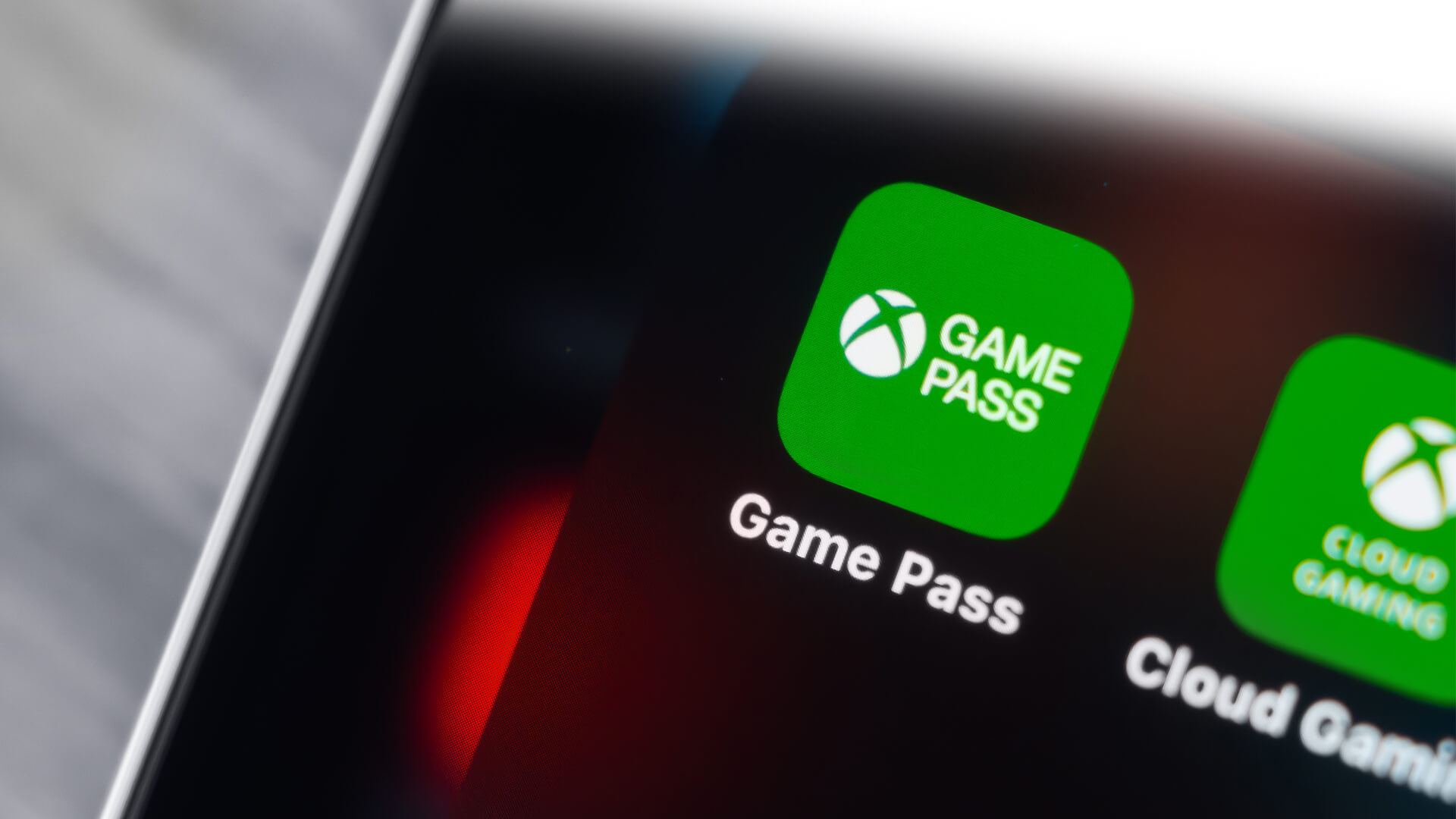 Close-up of Xbox Game Pass icons on a smartphone screen.